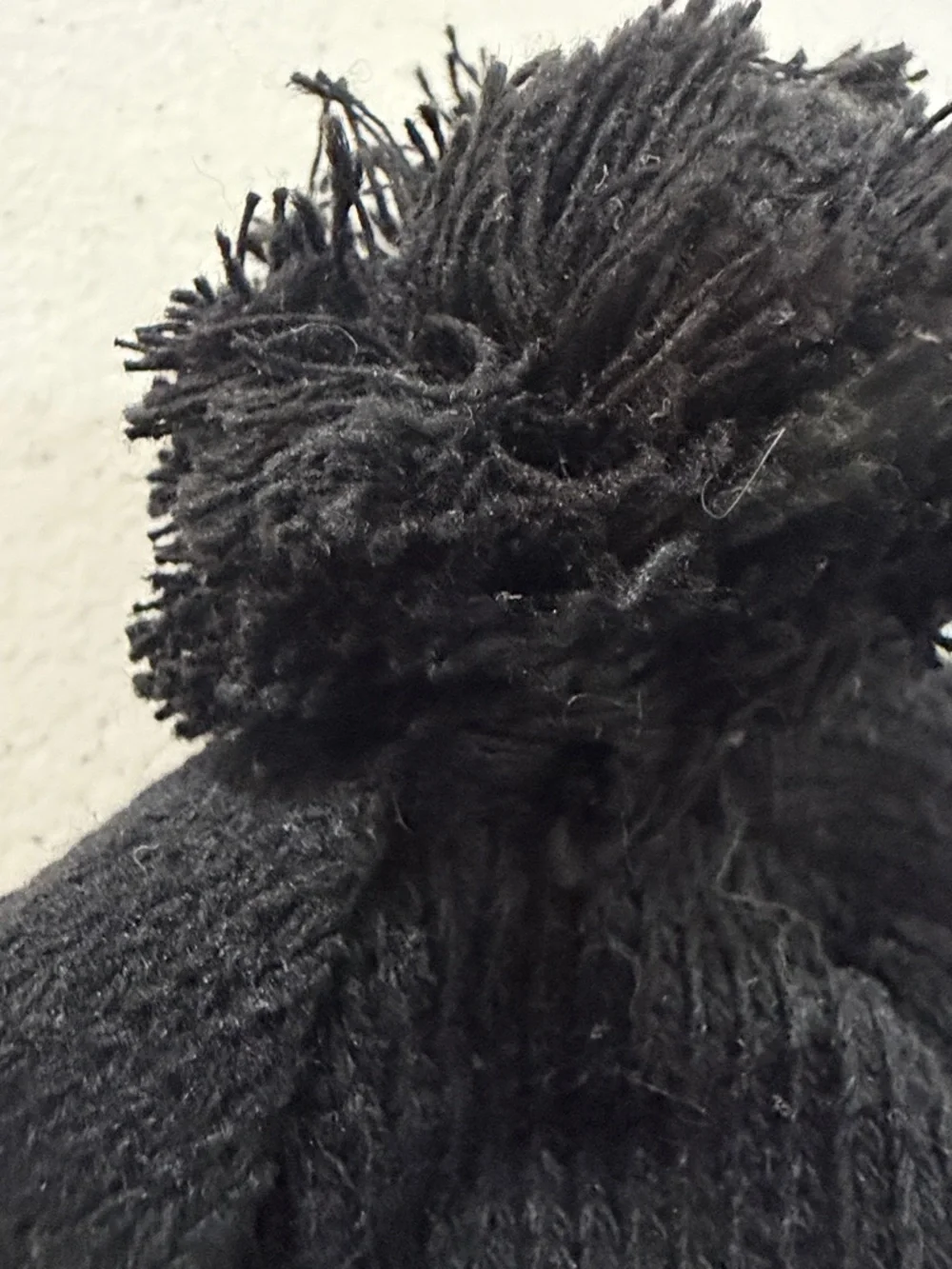Black Pom Pom Knit Beanie with White Snowflake Pattern